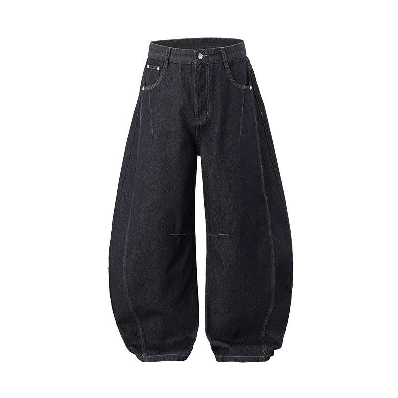 Men's original cow coloured wide leg denim trousers with a mid waist, laid flat.
