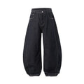 Men's original cow coloured wide leg denim trousers with a mid waist, laid flat.