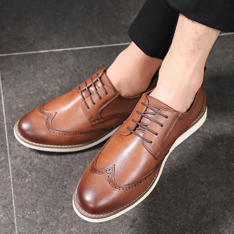 Men's black slip-on business casual shoes with decorative carved detailing and TPR soles