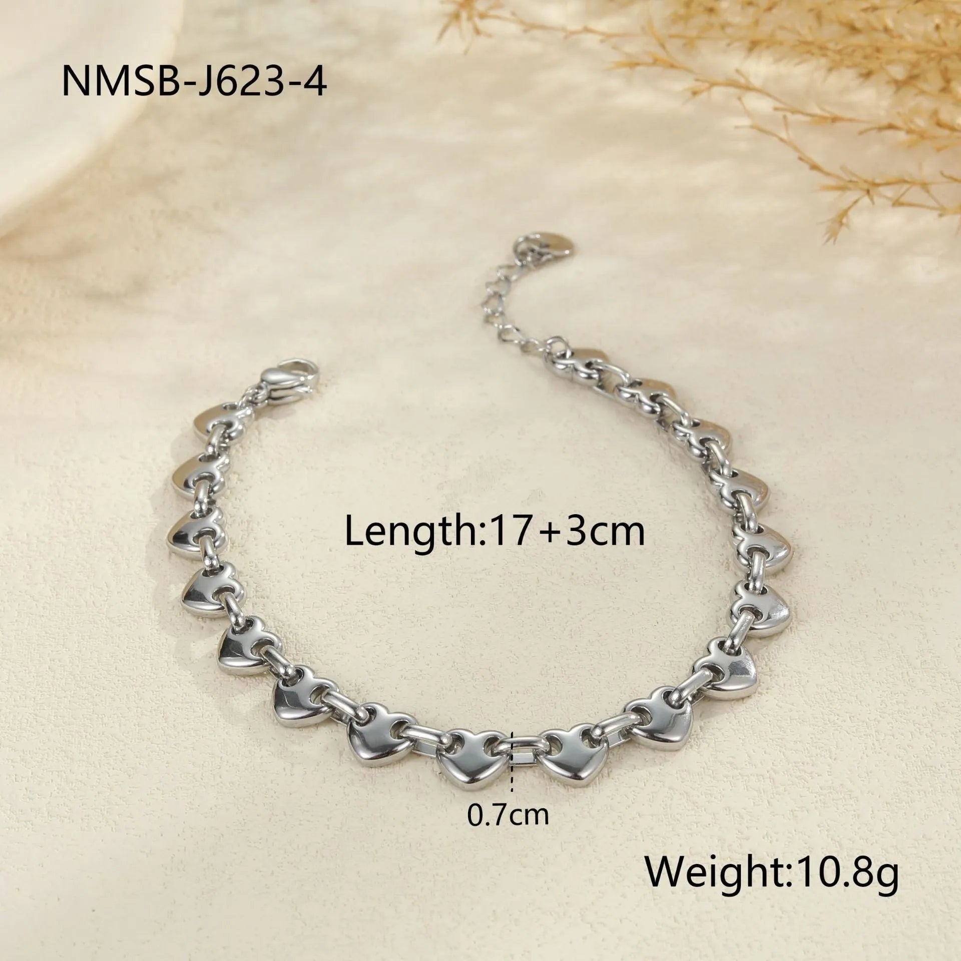 Women's geometric hollowed-out heart bracelet in stainless steel, available in gold or steel colour.