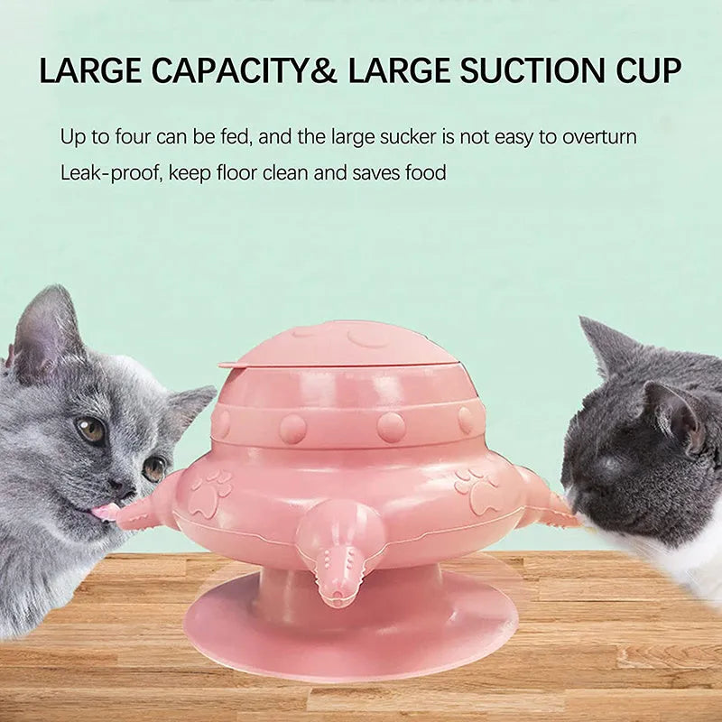 Pink silicone pet nursing milk bowl with four attached pacifiers on a flat base.
