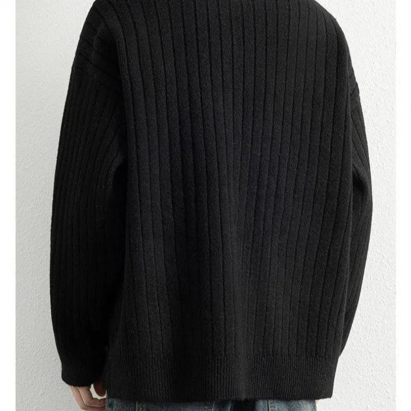 Men's grey loose fit half-zip pullover sweater with textured knit and long sleeves.