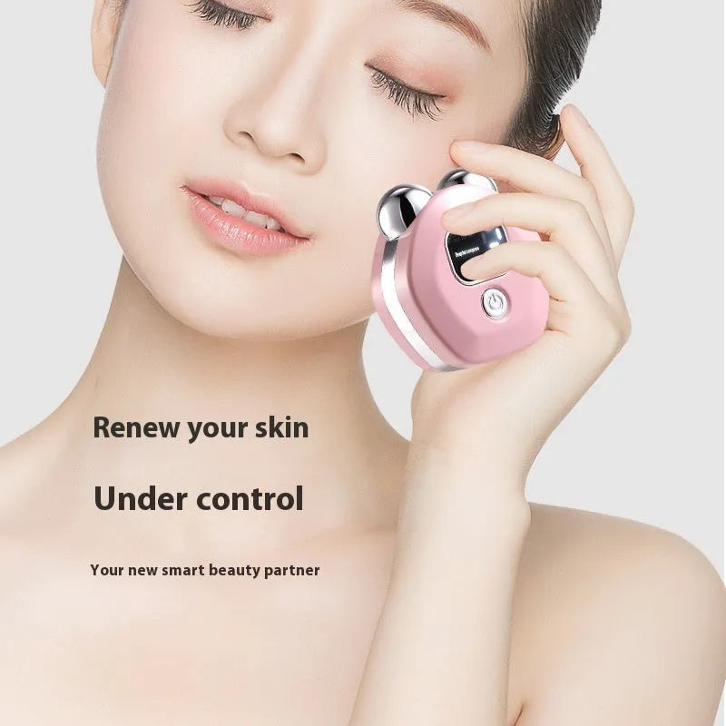 Portable hot compress and micro-current facial massage instrument in white, light blue, and pink colours with charging cable.