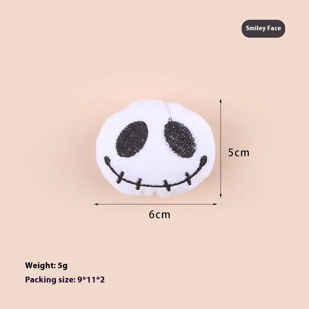 Small plush cat teaser toy with candy and skull designs in eyes or candy colours