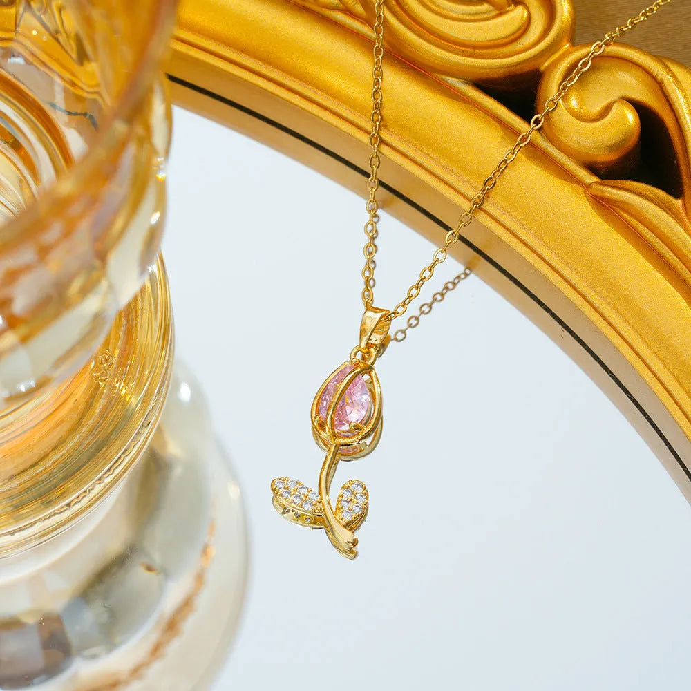 Gold zircon tulip flower pendant necklace on an adjustable titanium steel chain.