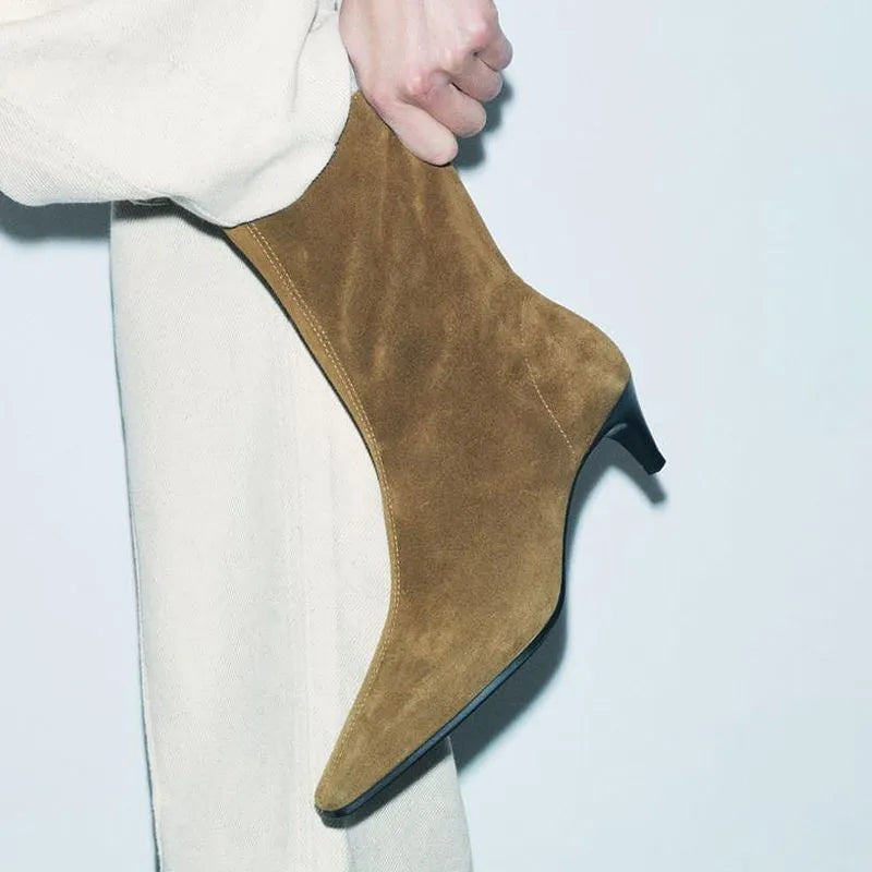 Brown square toe women's ankle boots with a side zip and a mid kitten heel on a waterproof platform sole.
