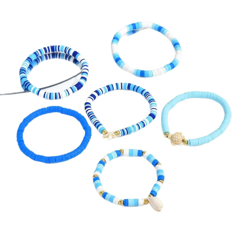 Bohemian blue polymer clay handmade shell bracelet suit with six geometric bracelets on display