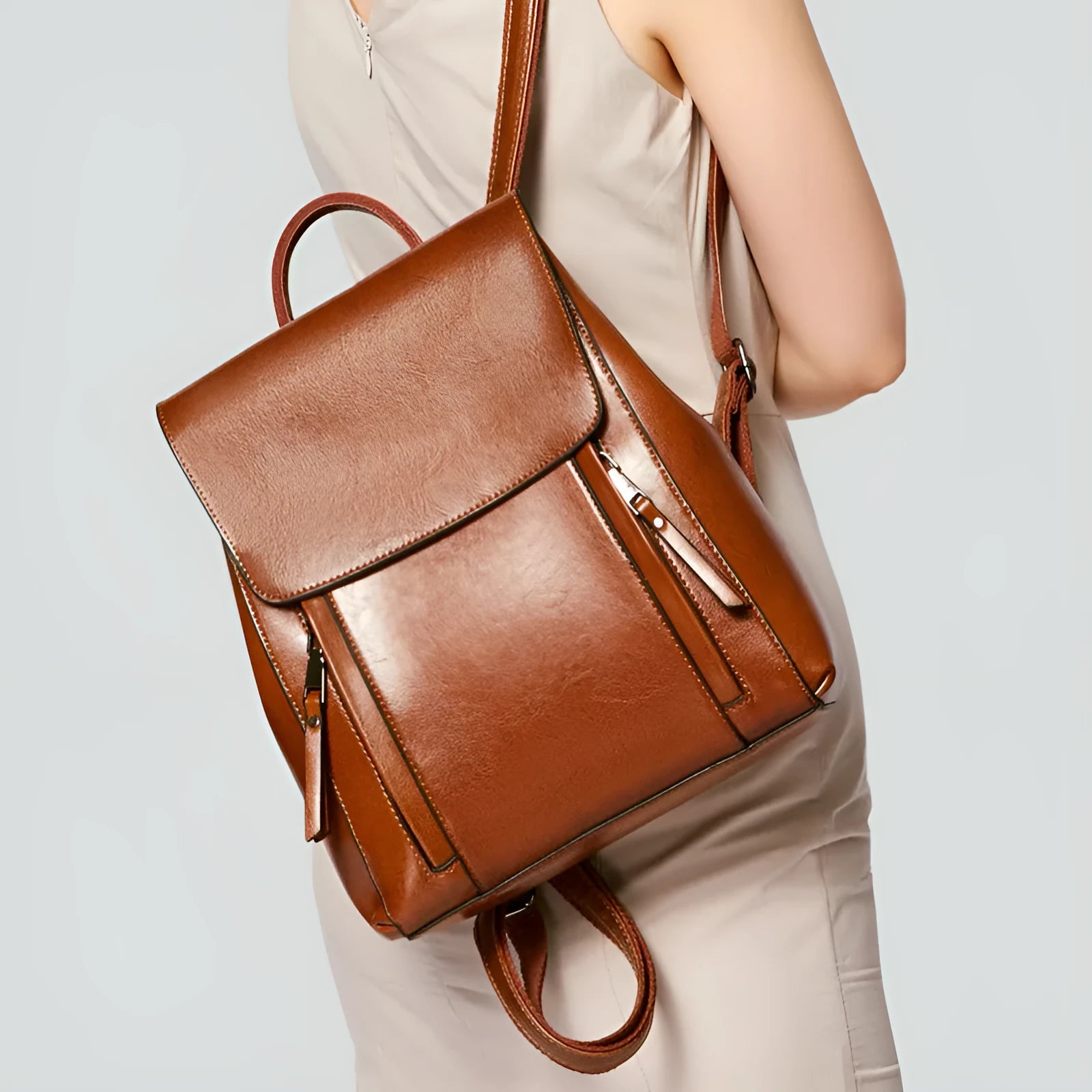 Genuine leather women's backpack in black with multiple compartments and dual shoulder straps