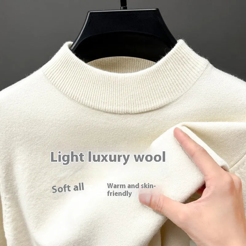 Men's solid colour fine yarn half-turtleneck long sleeve pullover on a hanger.