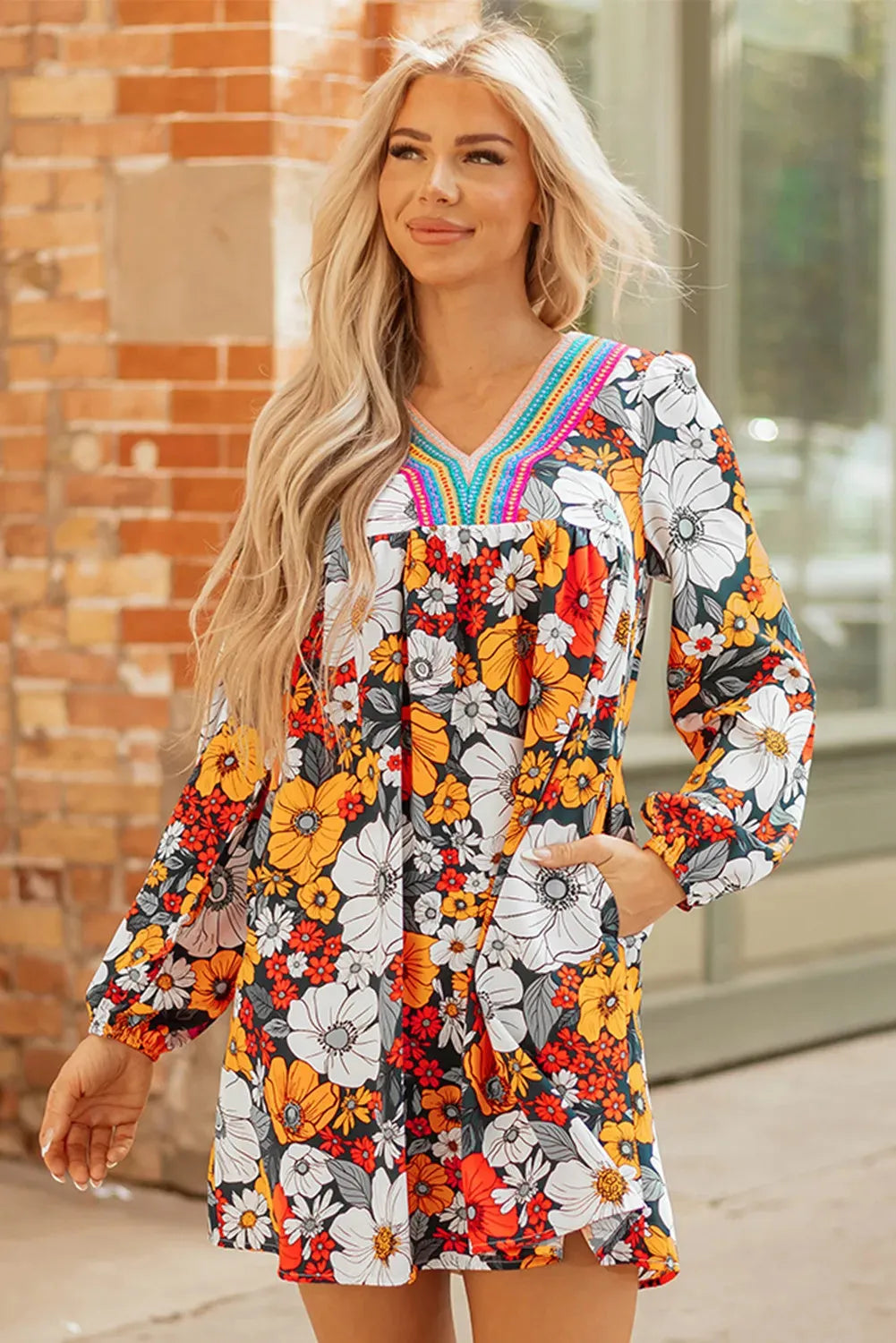 Orange floral print V-neck mini dress with striped lace detailing and long sleeves