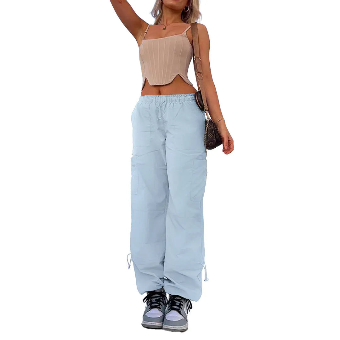 Straight-leg loose fit cargo casual pants in grey with multiple pockets, made from polyester fabric.