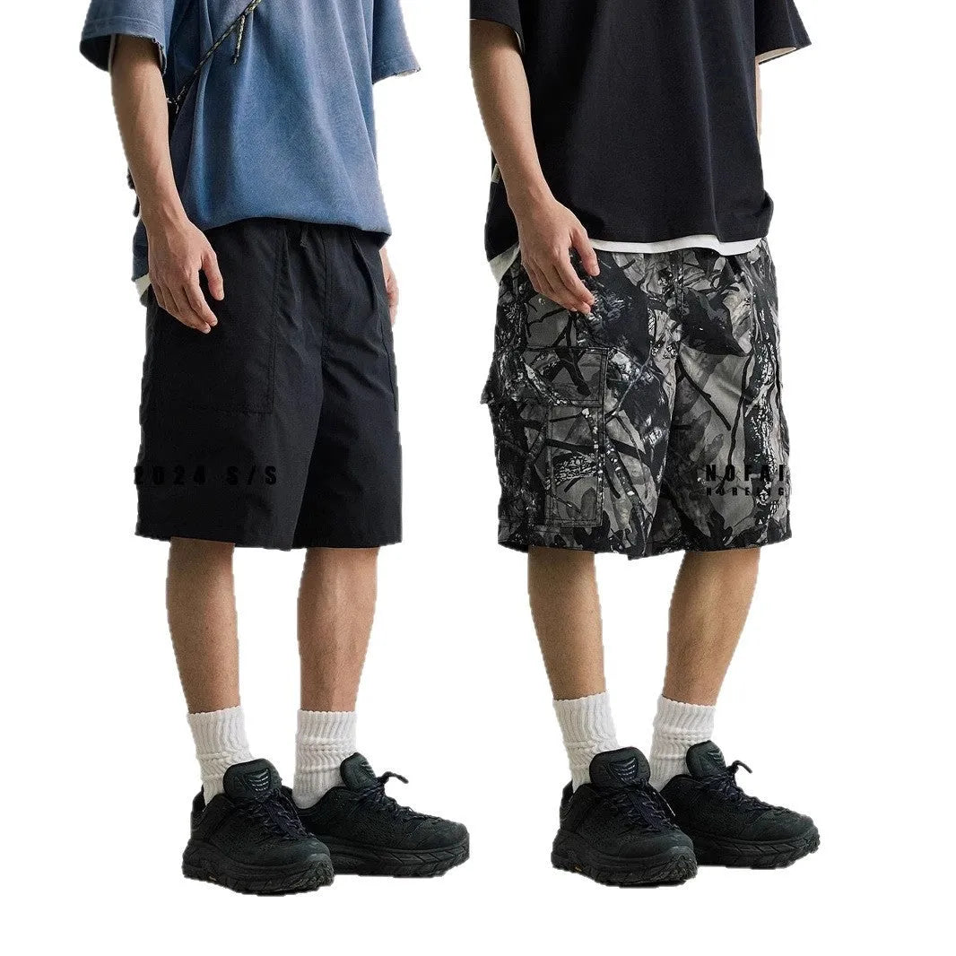 Loose straight-leg casual shorts in cotton denim, shown in army green colour.