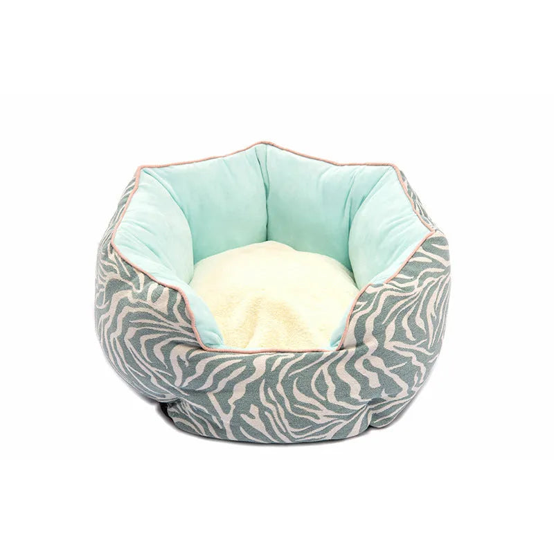 Blue octagonal pet sofa bed with a removable central mat for a small dog or cat.