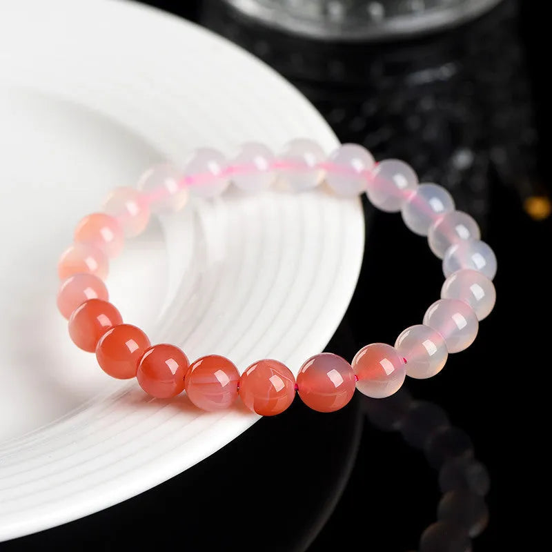 Natural gradient Yanyuan agate stone bracelet showing geometric beads in salt source colour, with size options.