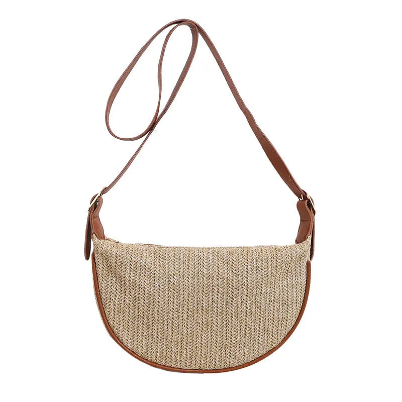 Knitted straw woven crossbody bag showing woven texture and internal organisation pockets