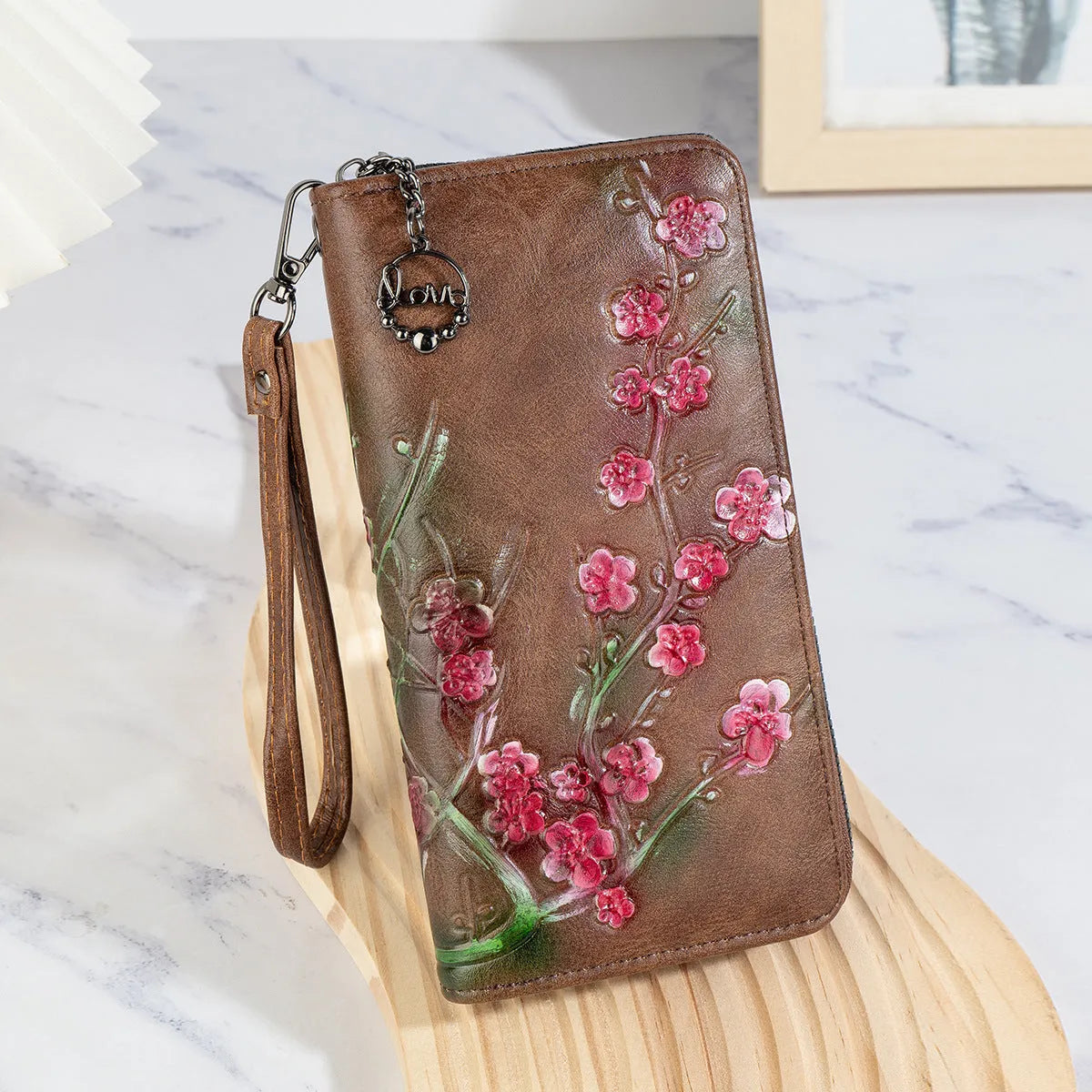 Embossed floral pattern Chinese style handbag in brown colour with zipper closure