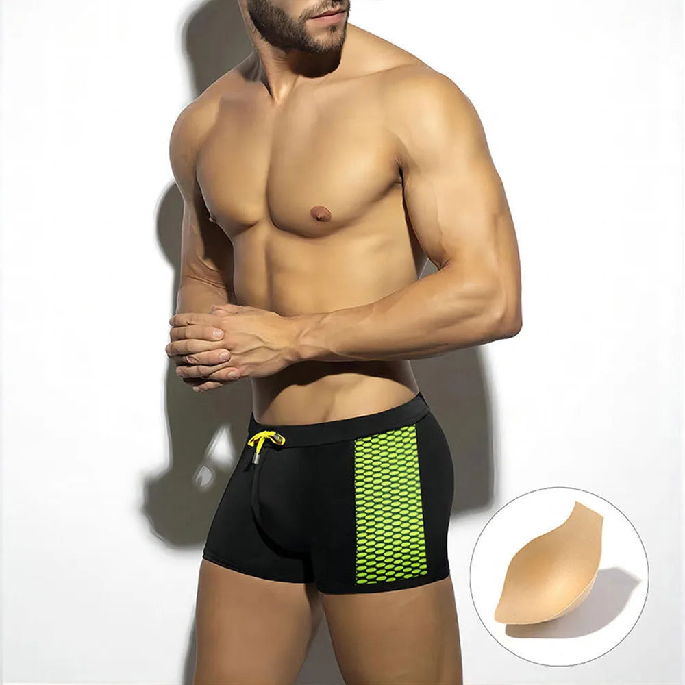 Men's polka dot print quick-drying swimming boxers in nylon fabric on a size chart.
