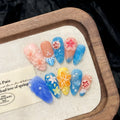 Plastic wearable armour set with 3D carved jellyfish design in almond nail colour.
