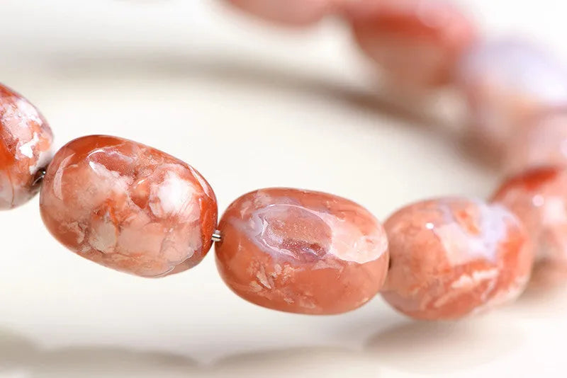 Natural cherry agate barrel bead bracelet with geometric 10x14mm beads and Ruyi charm