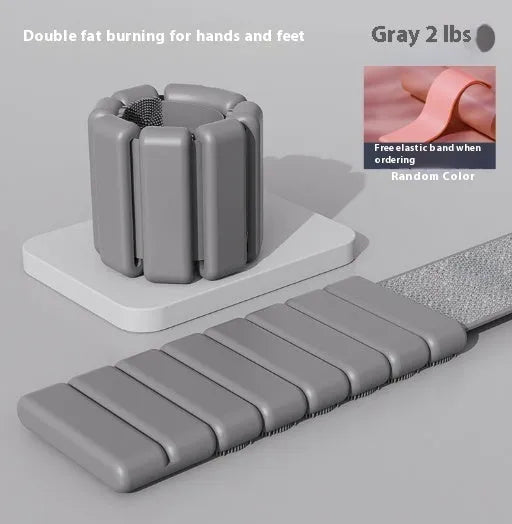 Silicone fitness bracelet with Velcro strap shown in pink, black, grey, and blue colours, with 1lb and 2lb weight options.