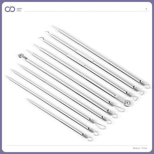 Four silver metal acne needles with pointed tips for skincare extraction.