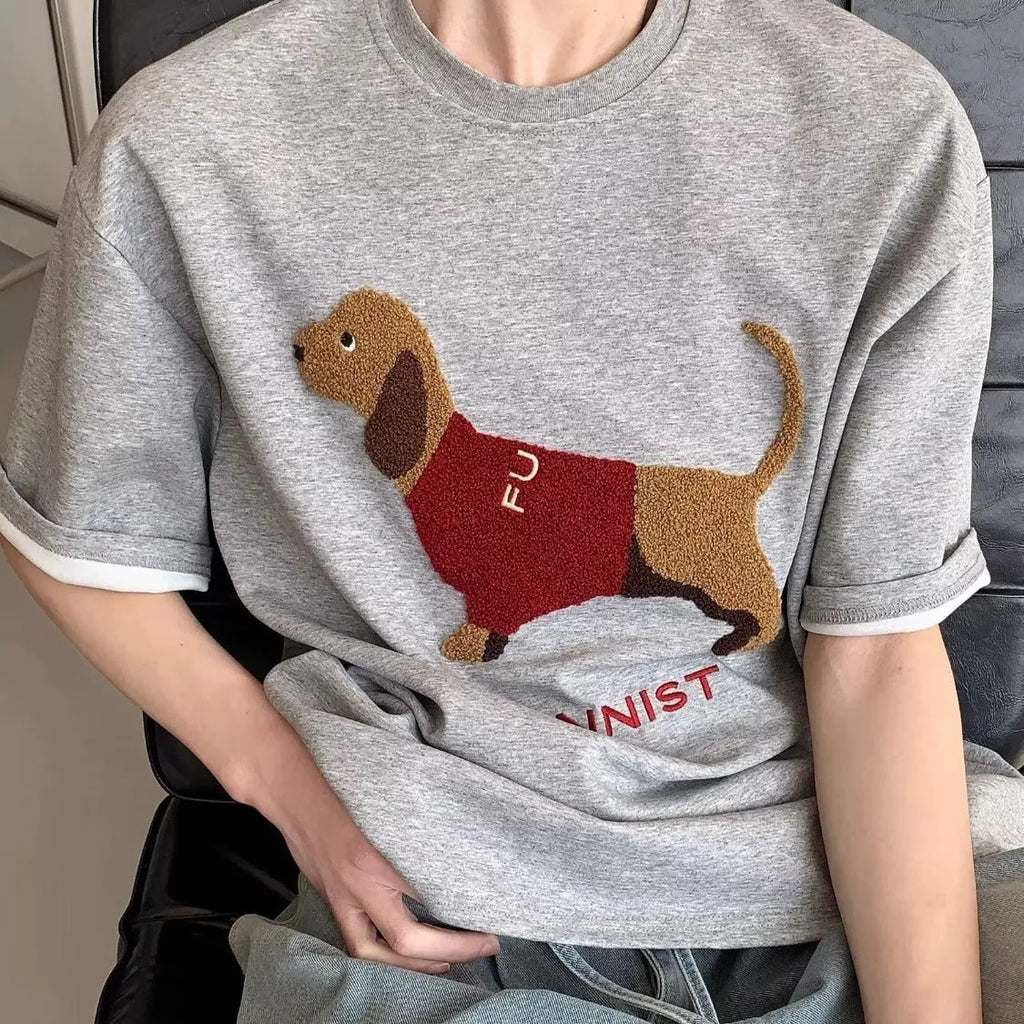 Men's grey t-shirt with embroidered sausage dog design on chest, round neck, short sleeves.