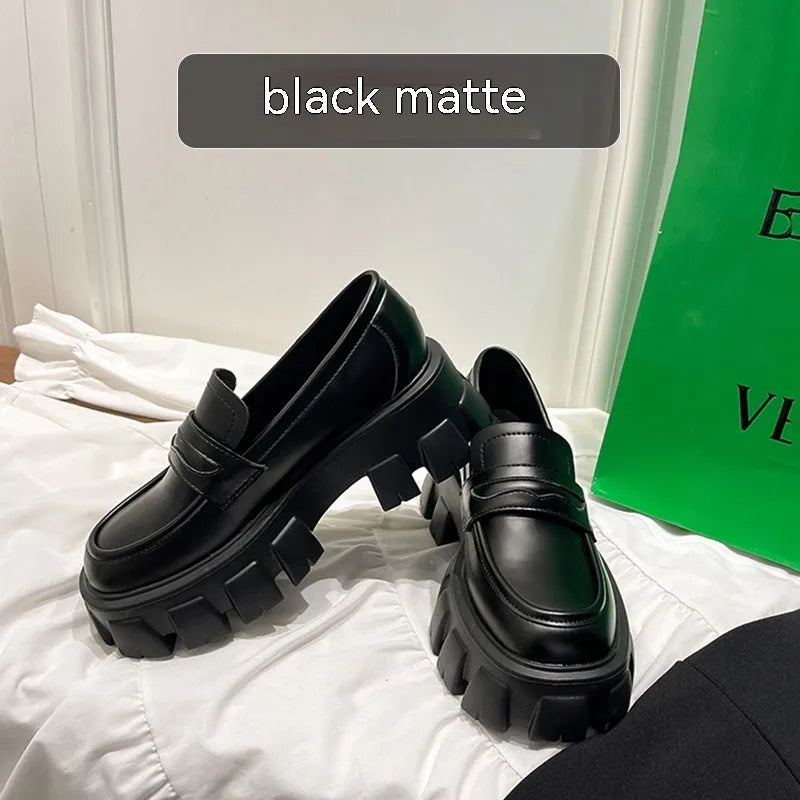 British style wide fat foot loafers in patent leather and matte finish, showing rubber sole and slip-on design.