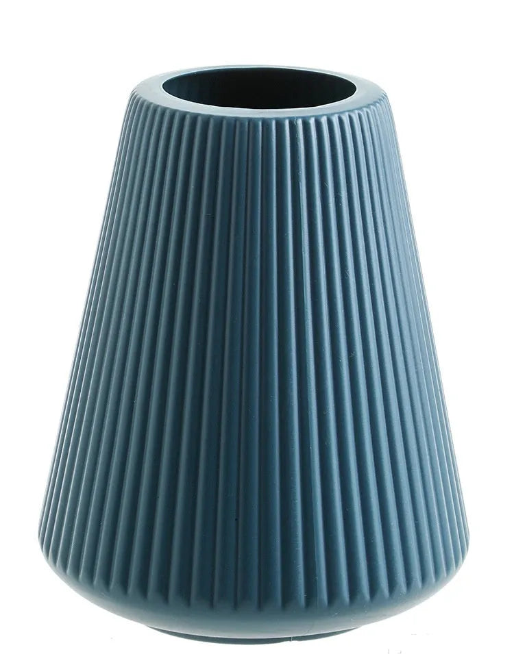 Colourful melamine plastic decorative flower vase measuring 16cm by 20cm on a desktop.