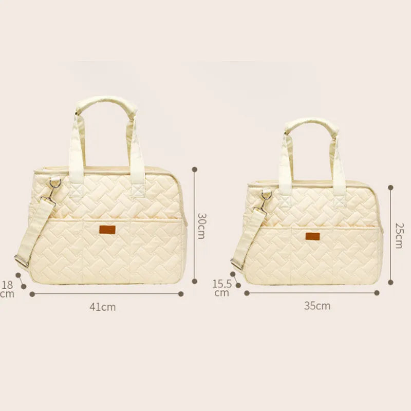 Grey nylon pet carrier handbag with mesh panels and a soft interior for a cat or small dog.