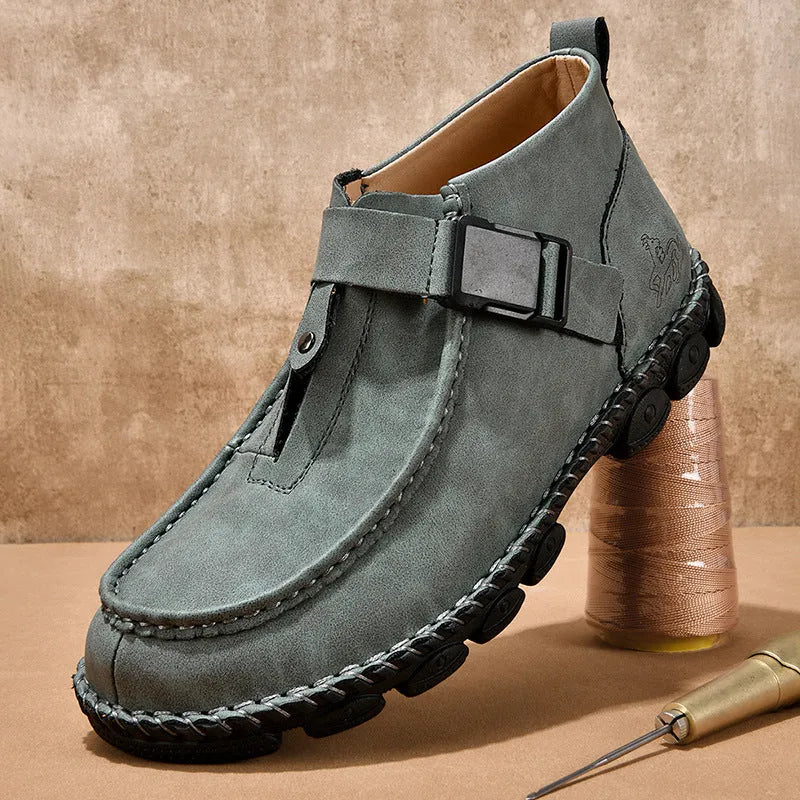 Black synthetic leather slip-on flat shoes with handmade stitching on the sole