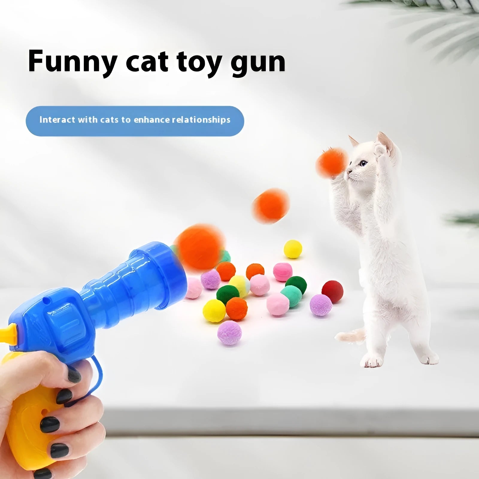 Pet toy launcher gun with assortment of soft plush balls for dog fetching games