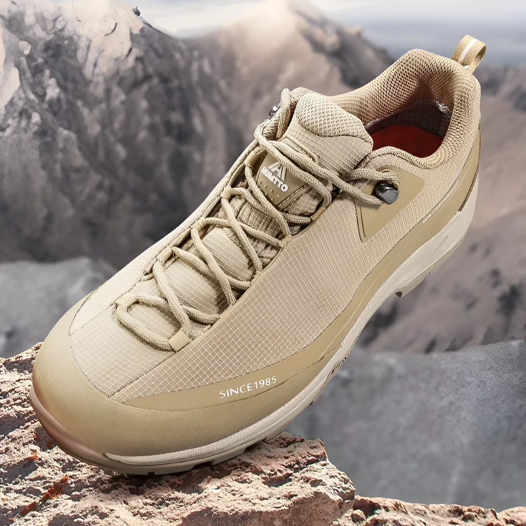 Men's low-top mountain climbing shoes in black with non-slip rubber outsole and lace-up design