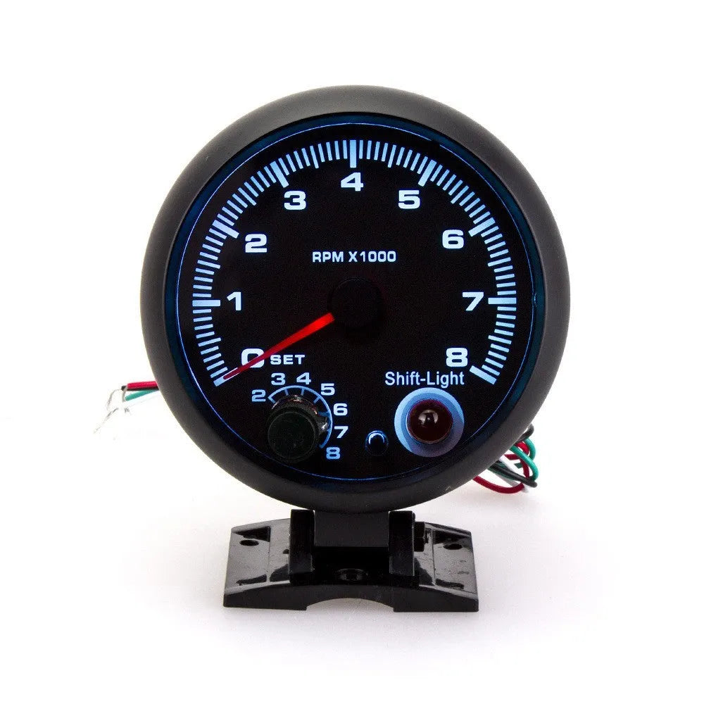 Black automotive tachometer with blue light pointer display for engine RPM measurement