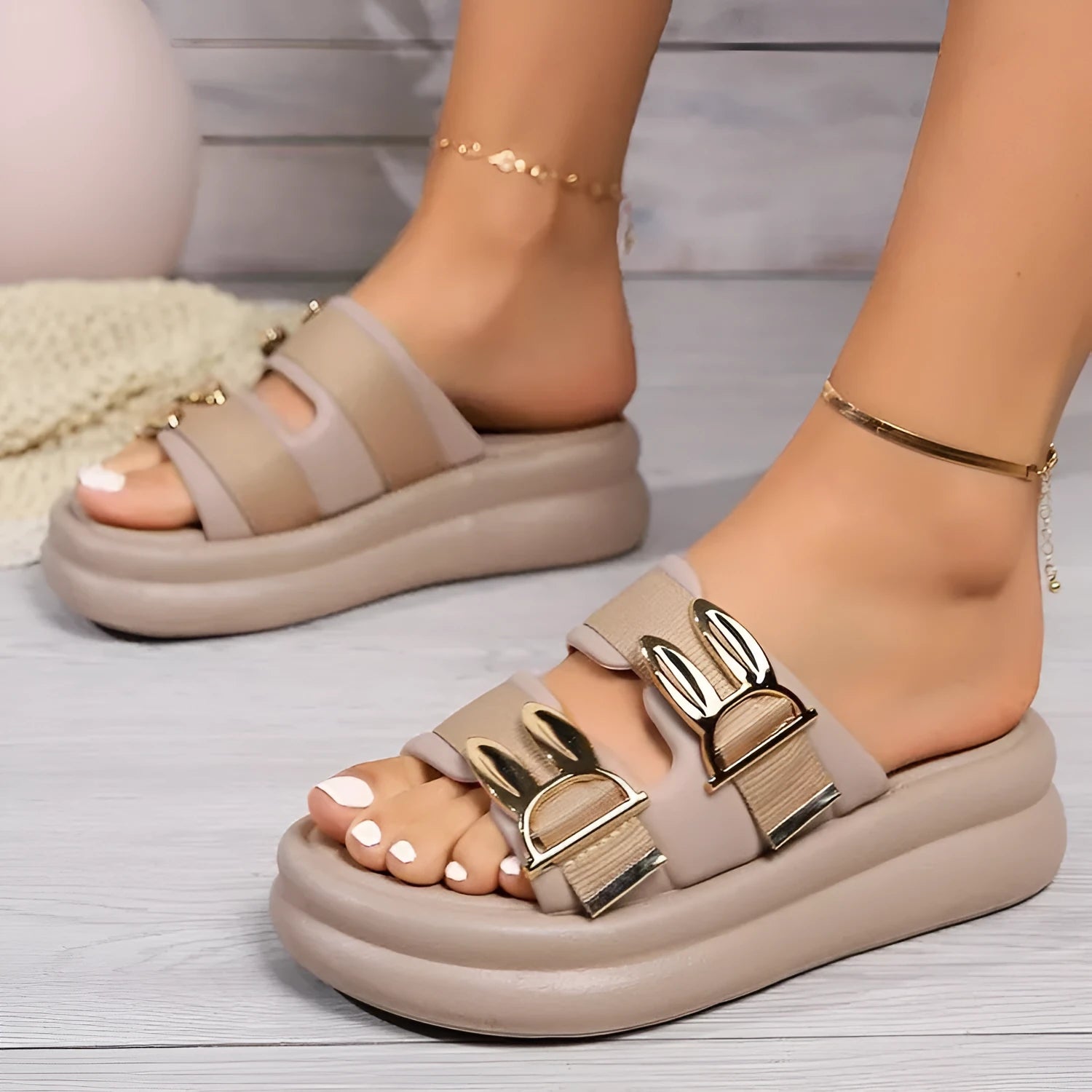 Women's slippers with suede uppers and thick rubber soles in apricot, black, and off white colours