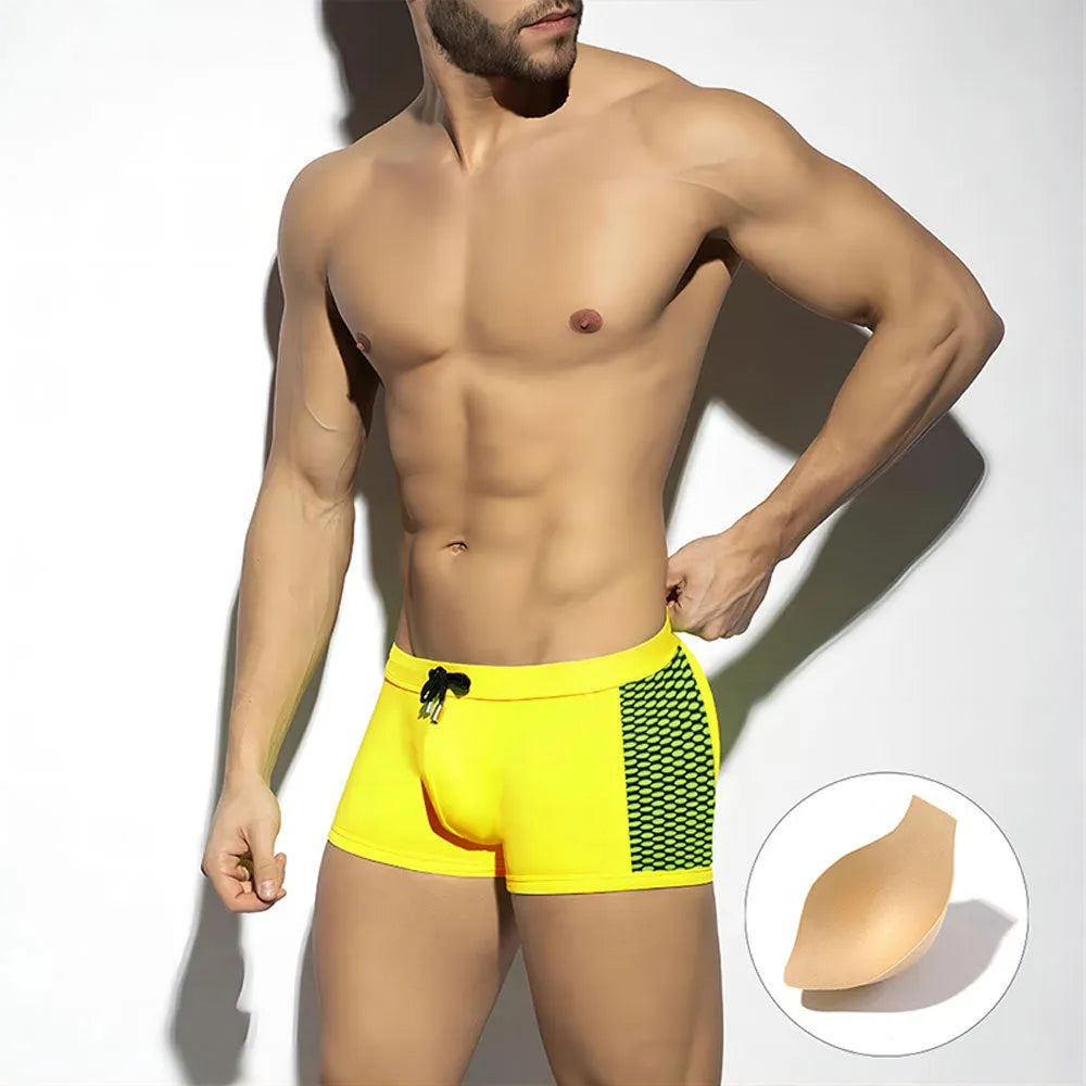 Men's polka dot print quick-drying swimming boxers in nylon fabric on a size chart.