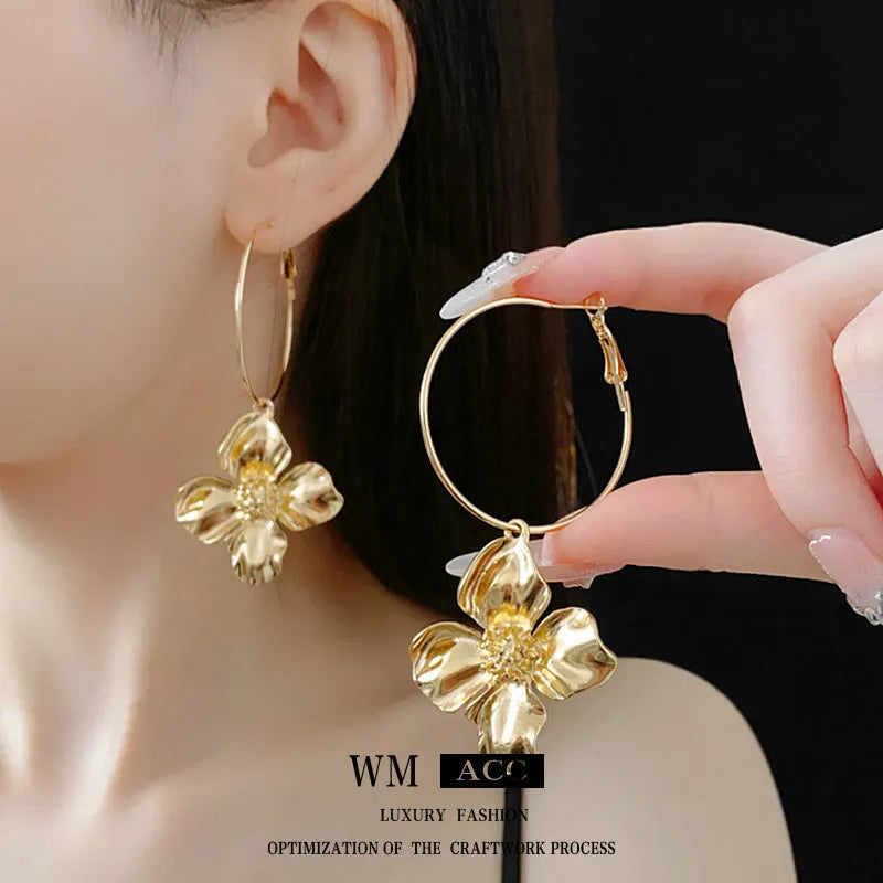 Metal flower geometric earrings with silver needle detail in gold or silver electroplated finish