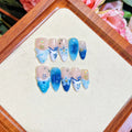 Blue hand-painted carved summer ice transparent plastic fake nails set in sizes XS, S, M, L.