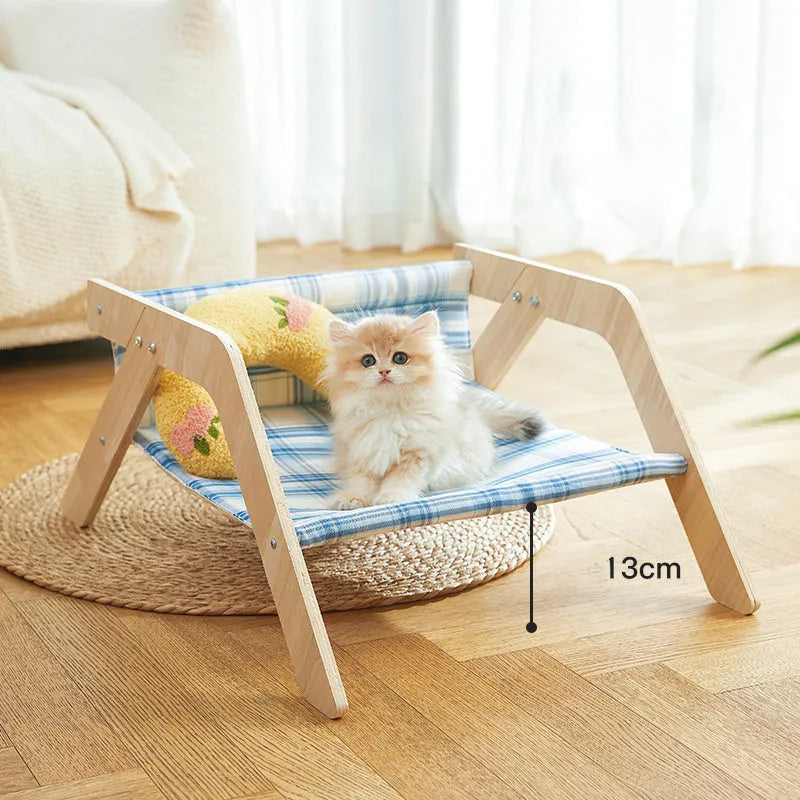 Green wooden elevated cat hammock bed for indoor lounging