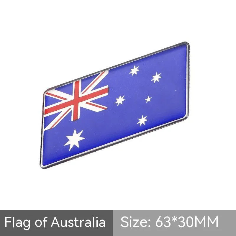 Aluminium metal car sticker with national flag design in a parallelogram shape.