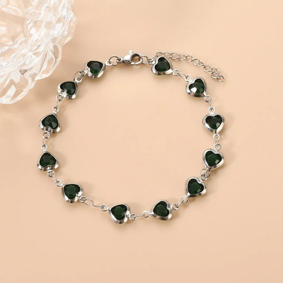 Devil's Eye geometric heart bracelet in stainless steel showing six colour options on white background