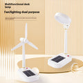 Ivory white solar charging table fan with dual-purpose LED study lamp on desk