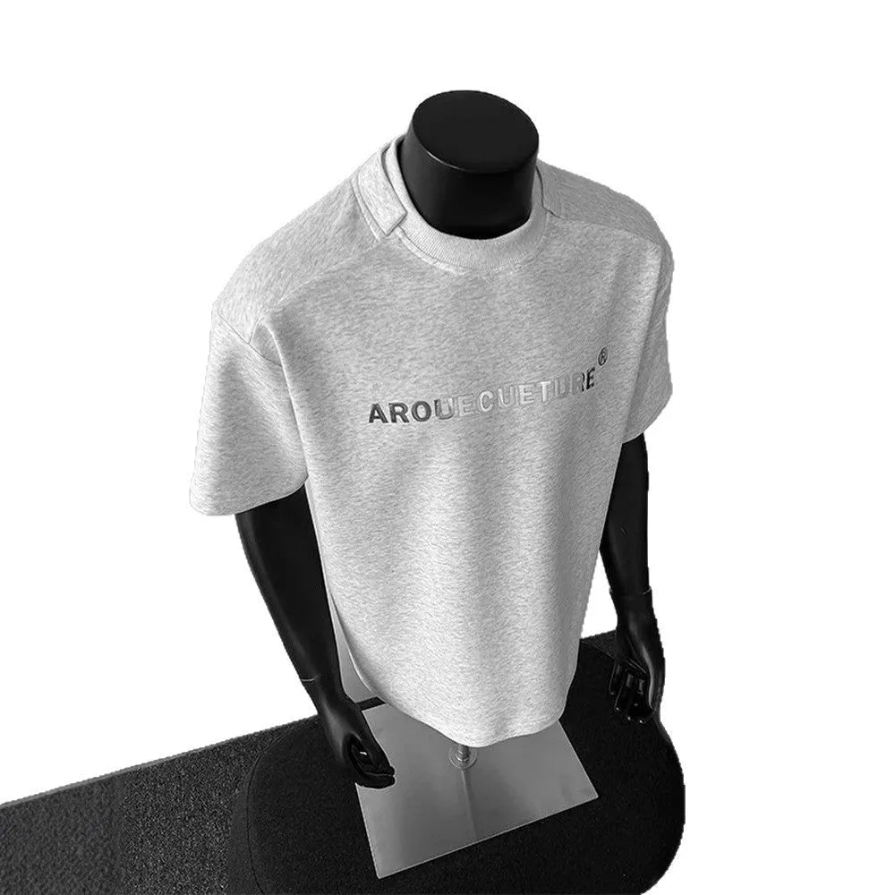 Men's plain black short sleeve cotton pullover shirt on a hanger, loose fit.