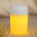 White cylindrical USB-powered mini humidifier with aromatherapy function on wooden desk