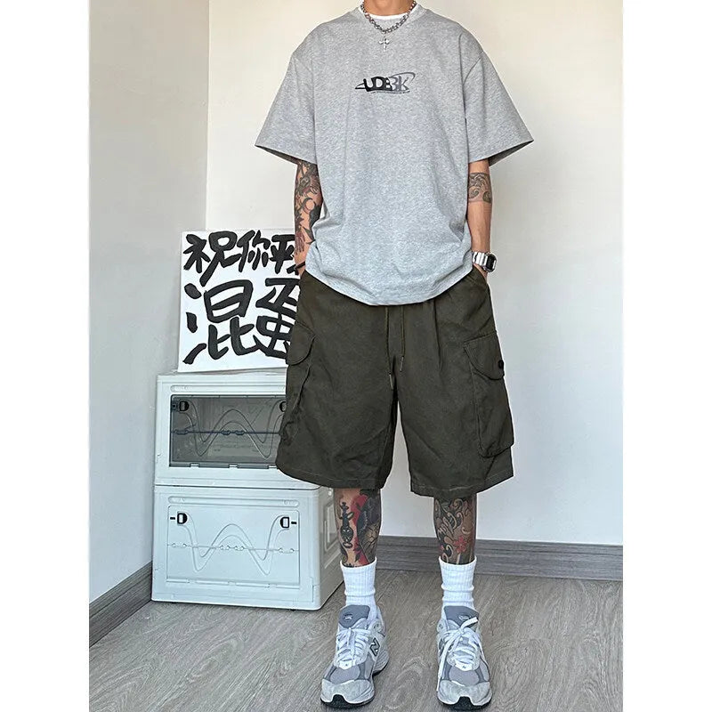 Man wearing loose straight-leg khaki casual sports shorts made from polyester