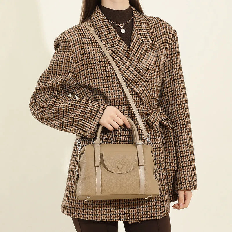 Genuine leather street trend ladies handbag with single shoulder strap in black, brown, or elephant grey.