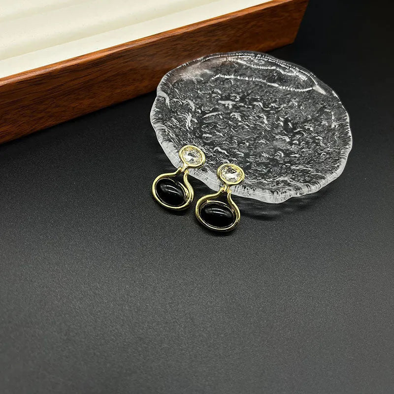 Black and gold geometric round oval alloy earrings with electroplated finish
