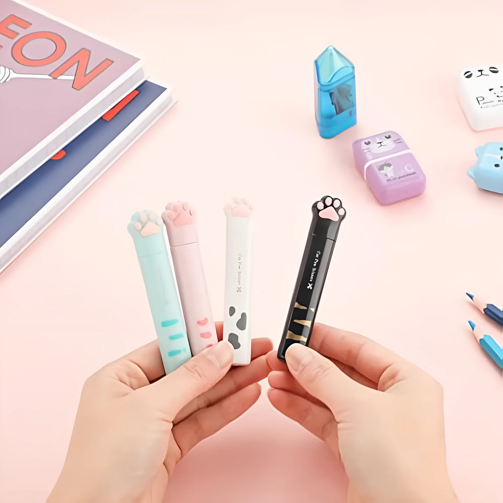 Cat paw mini folding scissors showing stainless steel blades and four colour options: pink, white, black, and blue