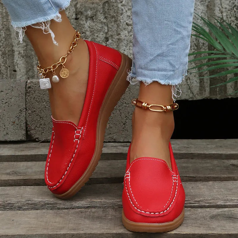 Women's flat slip-on loafers in PU leather, showing round toe and available colour options