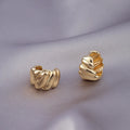 Gold-plated micro zircon stud earrings with woven twisted copper geometry design