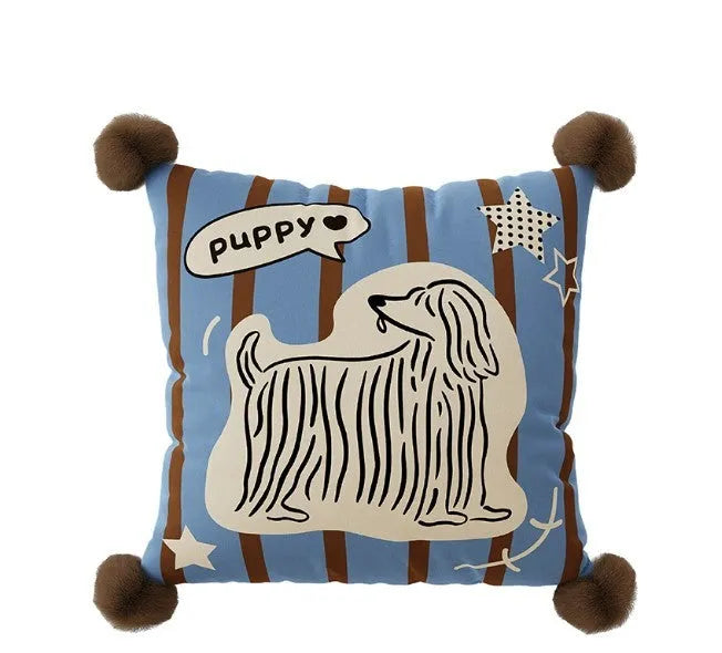 Blue cartoon animal print cushion and matching pillowcase on a sofa
